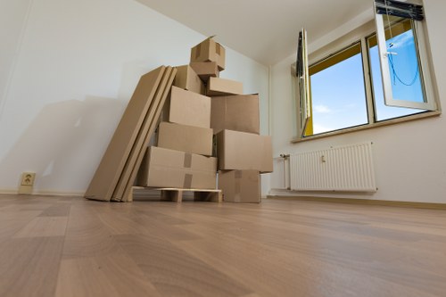 Movers carrying furniture during a local relocation